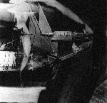 Click for 600-pixel-wide version - Hypodermic needle applying glue